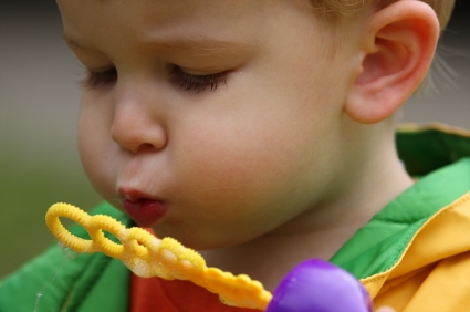 Child Blowing Bubbles