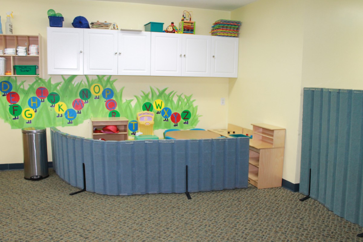 preschool classroom with ABCs painted on the wall